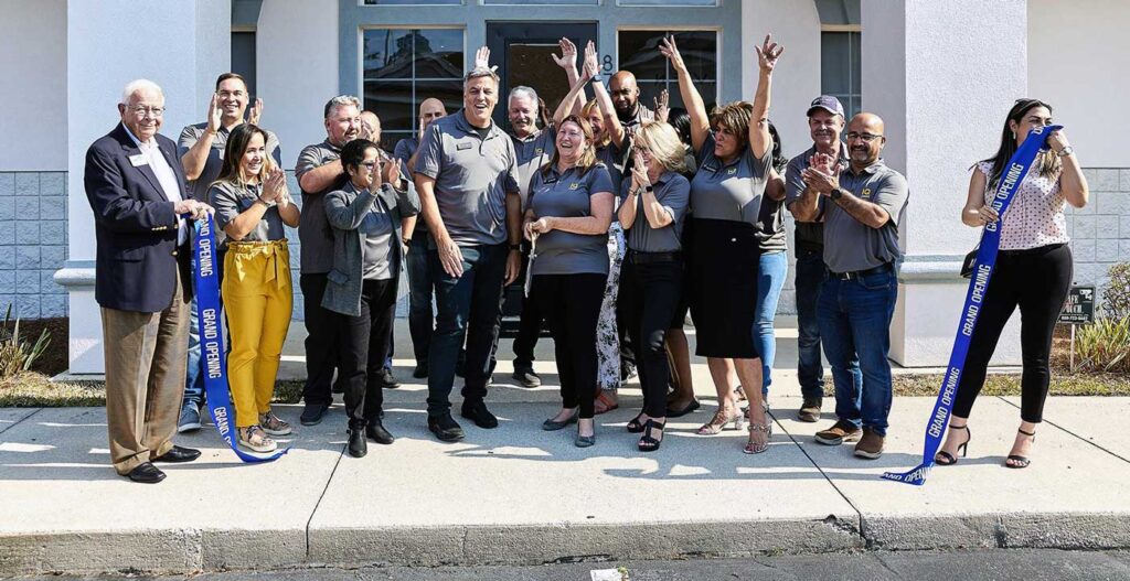 Group of employees at the ribbon cutting ceremony